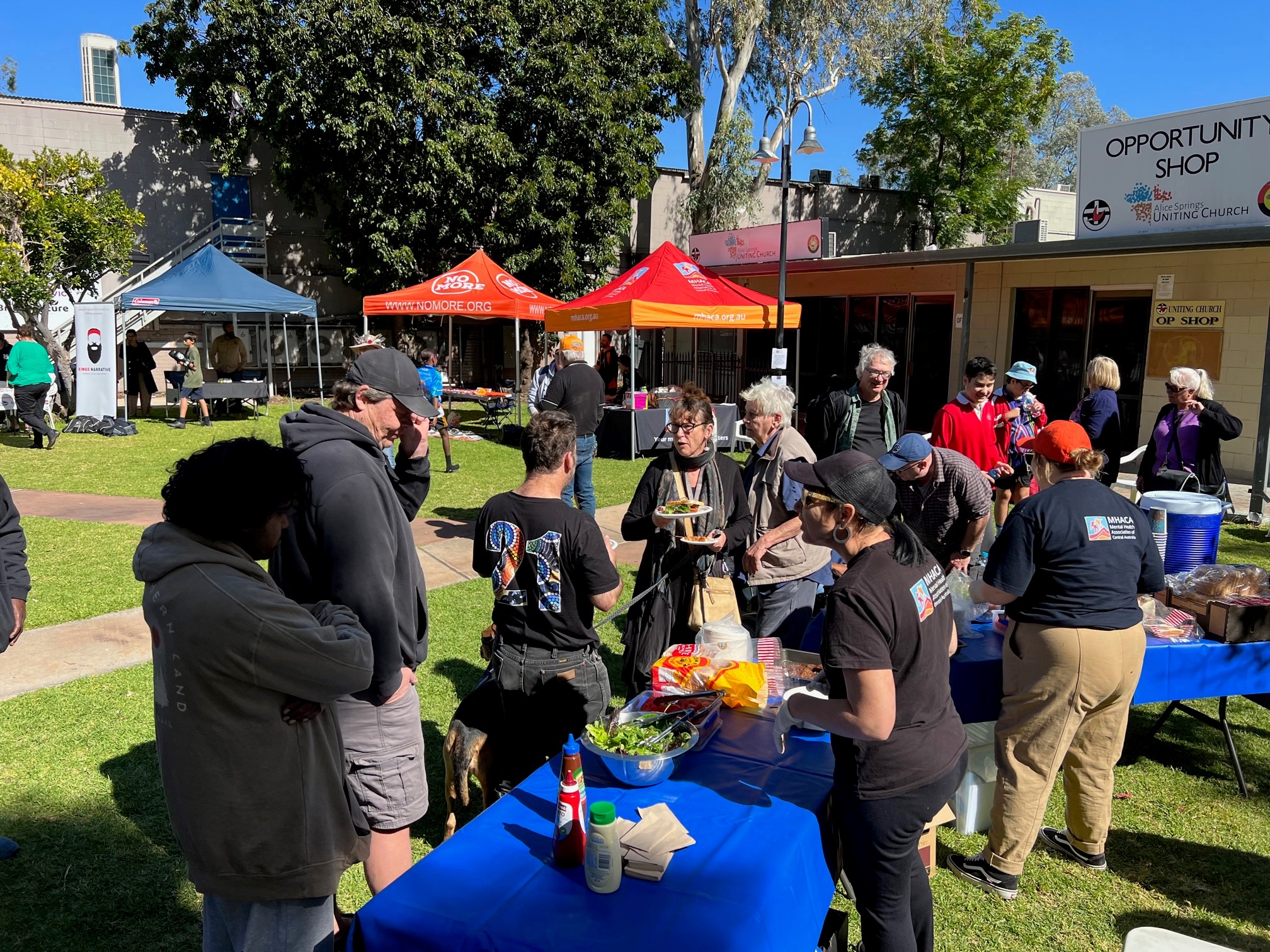 A group of people lining up for a healthy BBQ